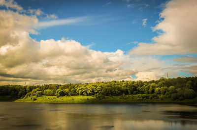 Scenic view of lake against cloudy sky