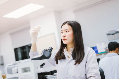 Scientist holding test tube at laboratory