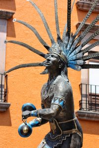 Close-up of statue against building