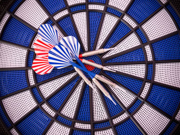 Directly above shot of darts on dartboard