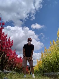 Man standing on land against sky