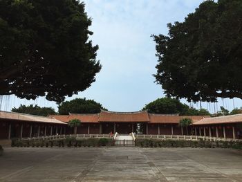 Gazebo by building against sky