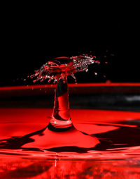 Close-up of water splashing against black background