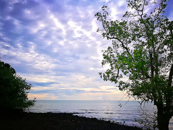 Scenic view of sea against sky at sunset