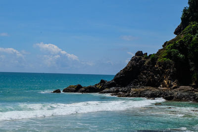 Scenic view of beach and sea against sky