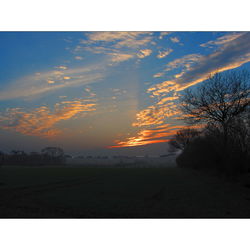 Scenic view of landscape at sunset