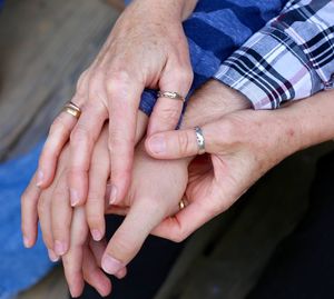 Close-up of couple holding hands