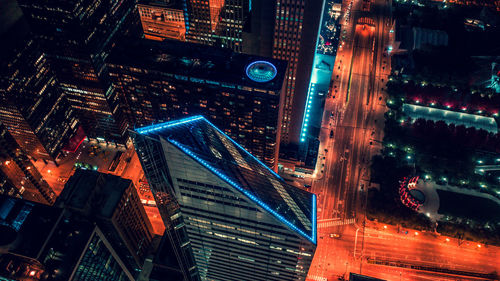 Aerial view of buildings in city at night