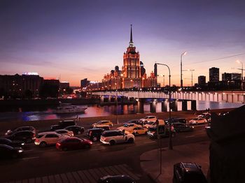 City buildings against sky during sunset