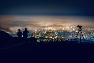 High angle view of illuminated cityscape against sky in hong kong