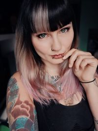 Portrait of beautiful tattooed woman