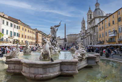 Famous navona square in rome with a blue sky