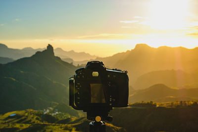 Scenic view of mountains against sky during sunset