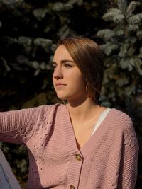 Portrait of a young woman looking away