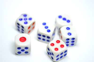 Close-up of dices over white background