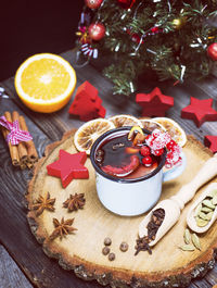 High angle view of christmas decoration with food and drink on table