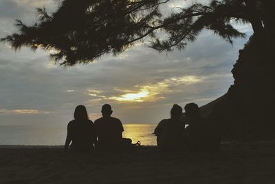 Silhouette of people at sunset