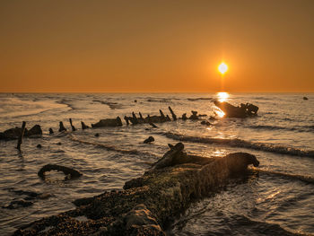 Scenic view of sea against sky during sunset