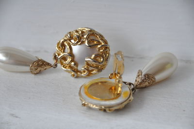 Close-up of earrings on table