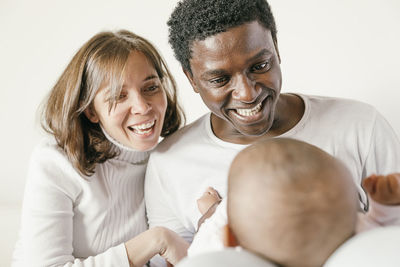 Parents playing with daughter at home