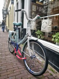 Close-up of bicycle on city street
