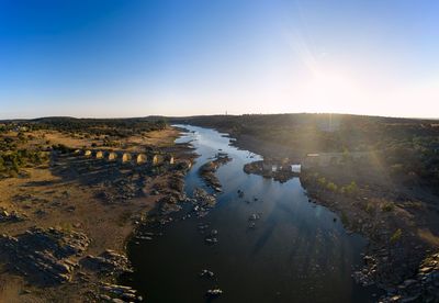 Scenic view of water against clear sky