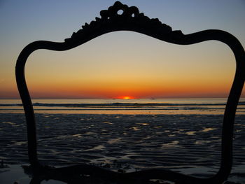 Scenic view of sea at sunset