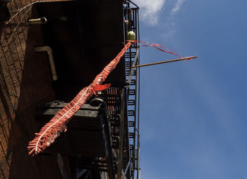 Low angle view of metal structure against sky