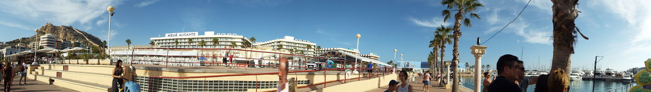 Panoramic view of buildings in city against sky