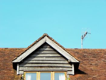 Low angle view of roof against clear sky