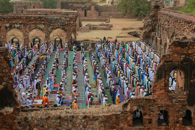 Muslims pray as others take part in eid al-fitr prayers in the ruins of the feroz shah kotla 