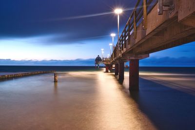 Bridge over sea against sky