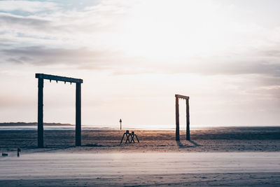 Scenic view of beach against sky during sunset