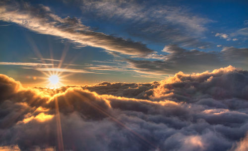 Sun shining through clouds