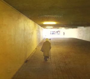 Blurred motion of woman in tunnel