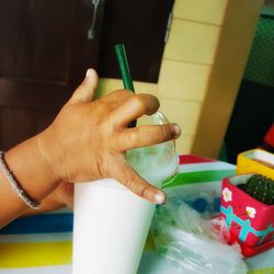 Close-up of hand holding ice cream