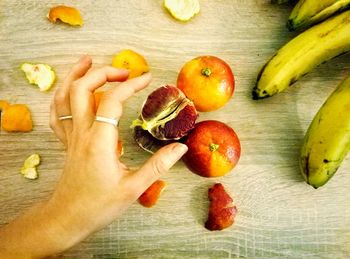 High angle view of man holding fruits