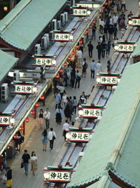 High angle view of people walking on road