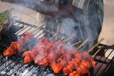 Close-up of meat on barbecue grill