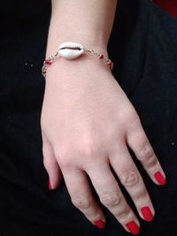 Midsection of woman wearing bracelet