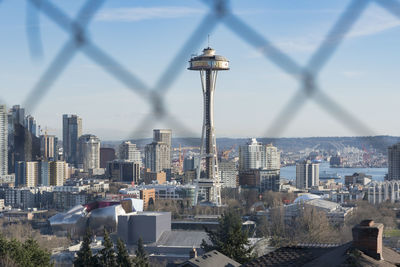 Space needle and buildings in city against sky