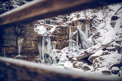 Snow covered trees and rocks