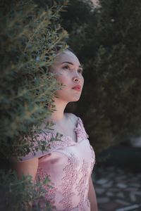 Portrait of a young woman looking away