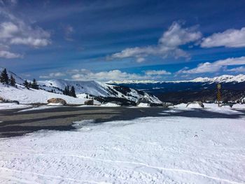 Scenic view of snowcapped mountains against sky