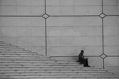 Woman on steps against sky