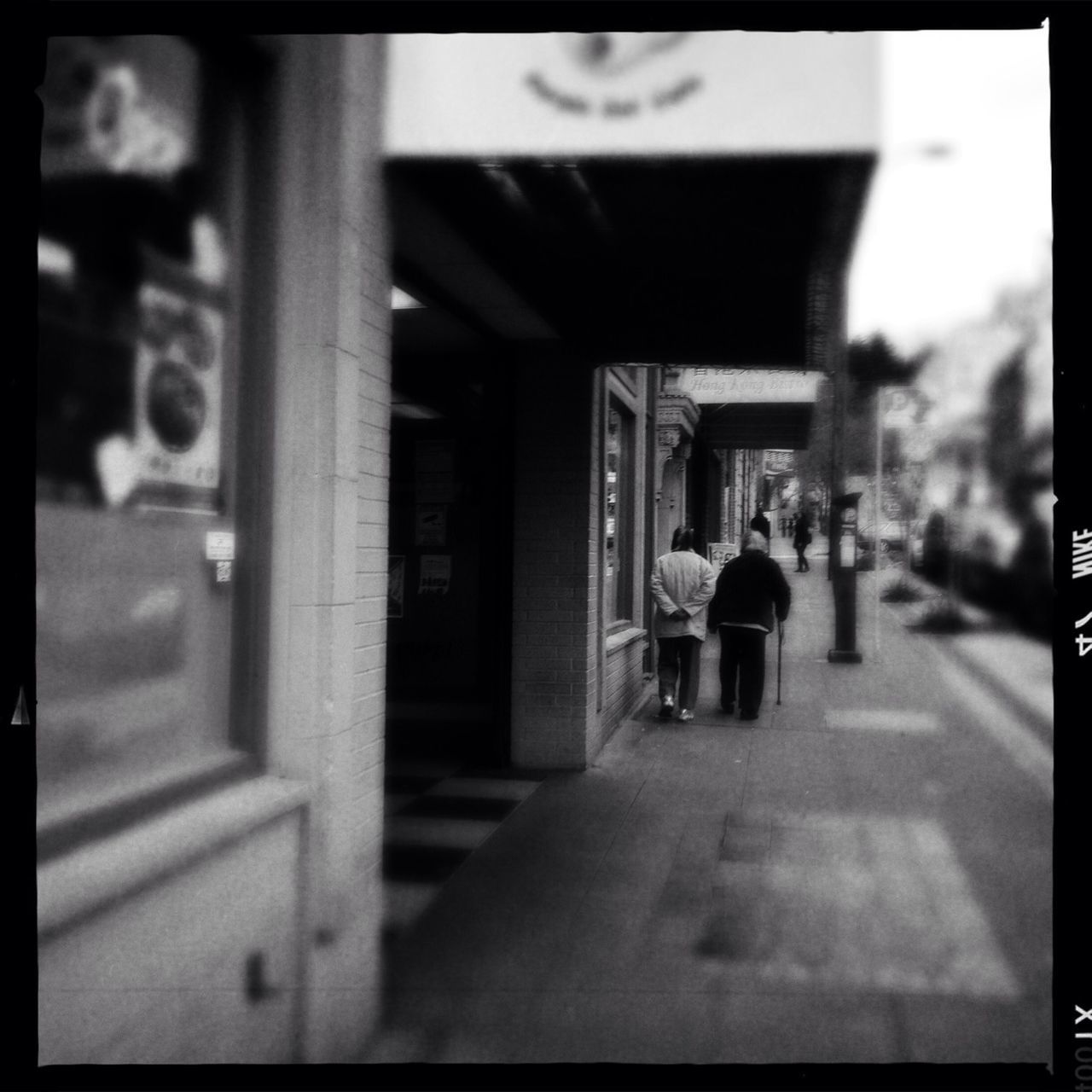 transfer print, architecture, built structure, auto post production filter, building exterior, rear view, indoors, incidental people, walking, men, focus on foreground, city, street, selective focus, city life, lifestyles, transportation, person