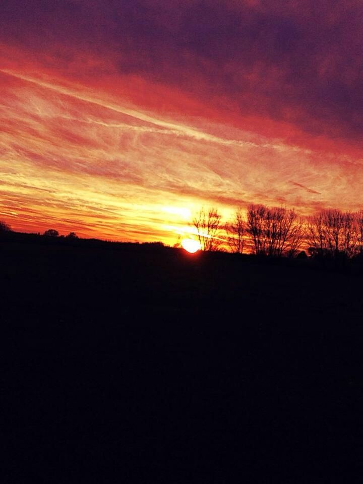 sunset, silhouette, orange color, scenics, tranquil scene, beauty in nature, sky, tranquility, sun, idyllic, nature, landscape, dramatic sky, cloud - sky, dark, cloud, majestic, moody sky, outdoors, atmospheric mood