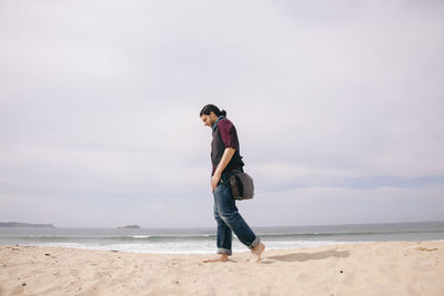 Full length of man walking at beach