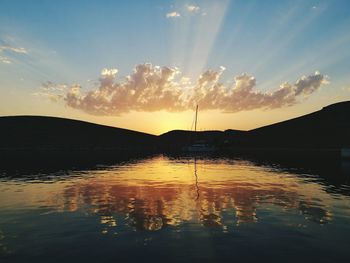 Scenic view of lake against sky during sunset