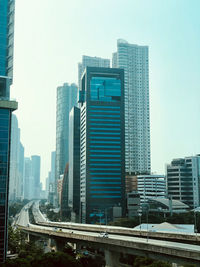 Modern buildings against sky in city